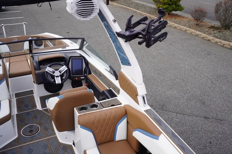 Slide: The Image of 2023 Tigé 24RZX boat interior with modern dashboard and luxurious seating. - 35