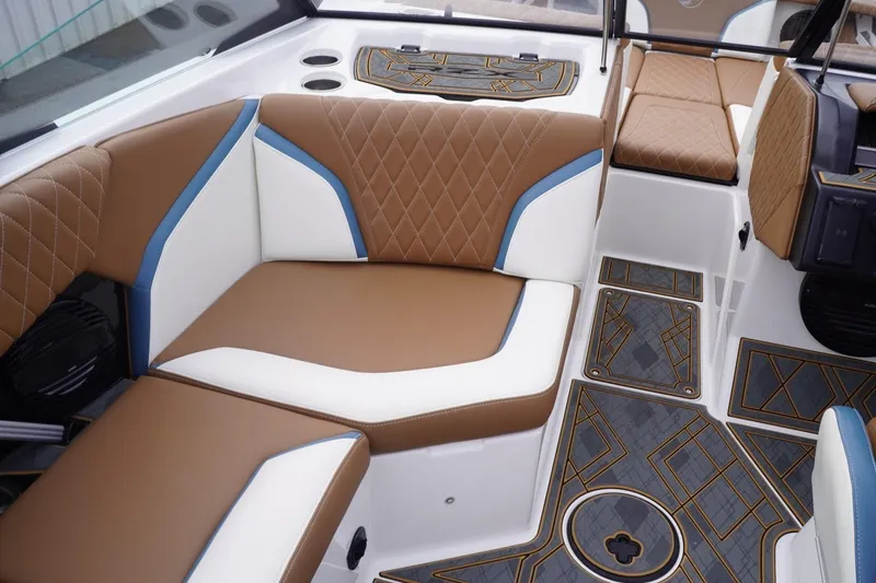 Slide: The Image of 2023 Tigé 24RZX boat interior with brown and white seating, stylish flooring. - 37