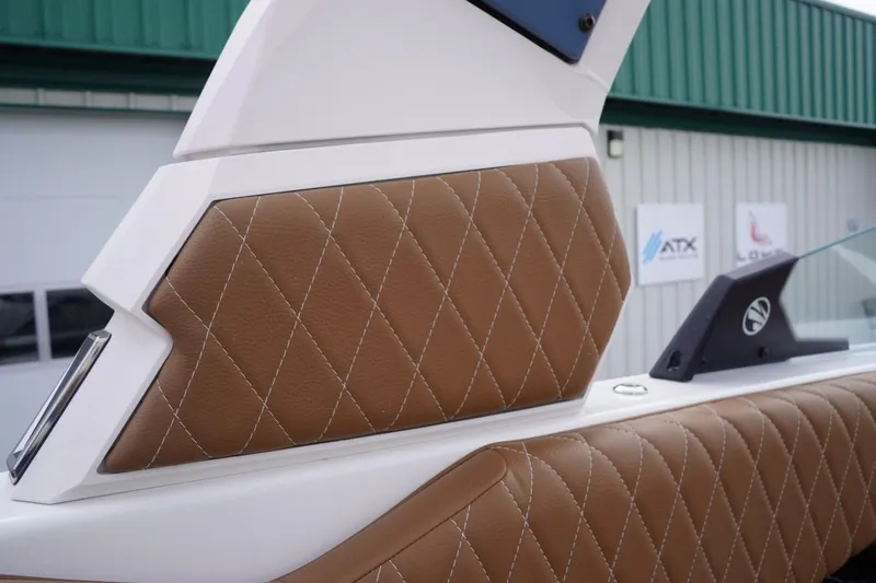 Slide: The Image of 2023 Tigé 24RZX boat interior with diamond-stitched brown leather upholstery. - 40