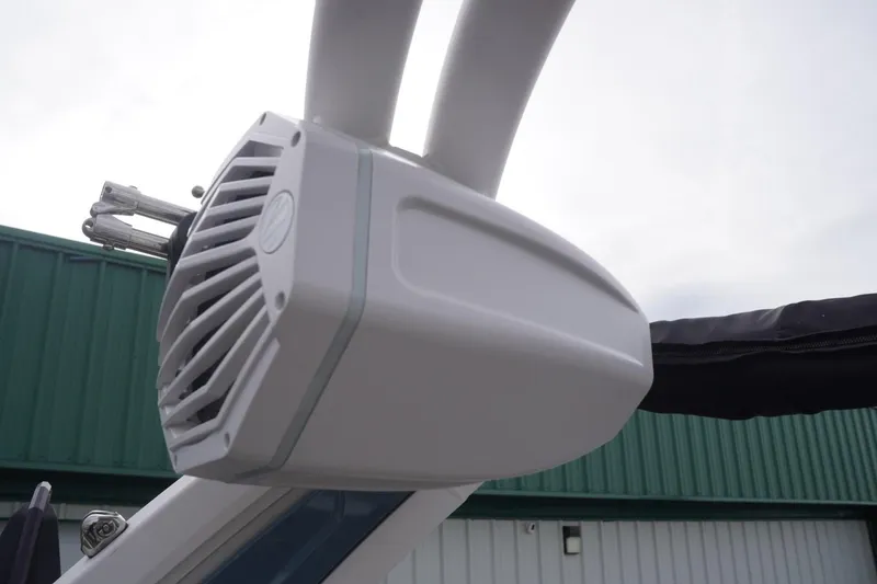 Slide: The Image of 2023 Tigé 24RZX boat speaker detail against a cloudy sky background. - 41