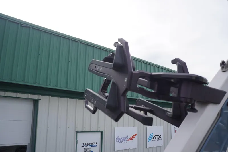 Slide: The Image of 2023 Tigé 24RZX boat accessory against a green building backdrop. - 42