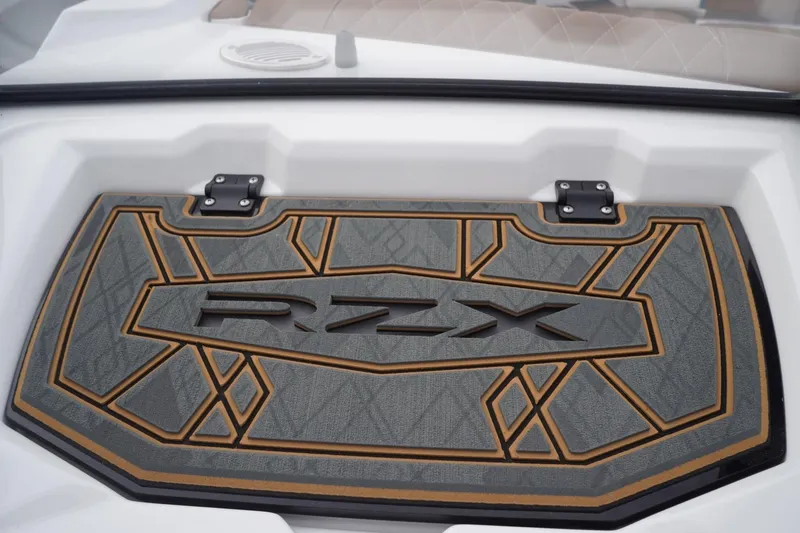 Slide: The Image of 2023 Tigé 24RZX boat deck with stylish geometric design and RZX branding. - 45