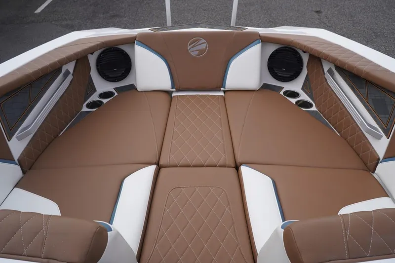Slide: The Image of 2023 Tigé 24RZX boat interior with brown and white cushioned seating. - 47