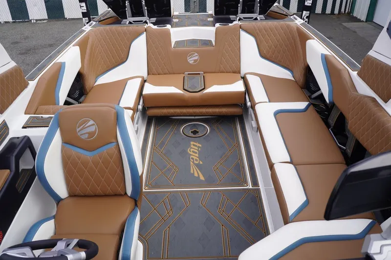 Slide: The Image of Luxurious interior of 2023 Tigé 24RZX boat with brown and white seating. - 51