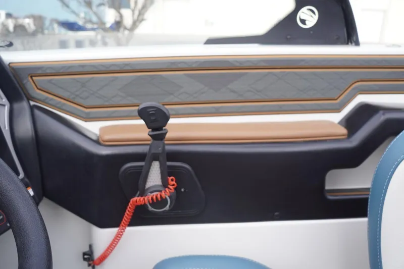 Slide: The Image of Interior of 2023 Tigé 24RZX boat, featuring stylish paneling and safety cord. - 53