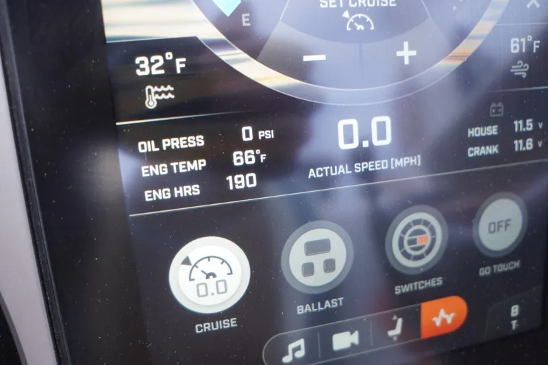 Slide: The Image of Touchscreen display of 2023 Tigé 24RZX showing engine stats and controls. - 57