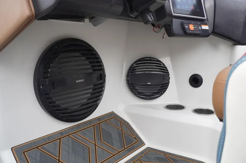 Slide: The Image of 2023 Tigé 24RZX interior with Audison speakers and modern dashboard controls. - 58