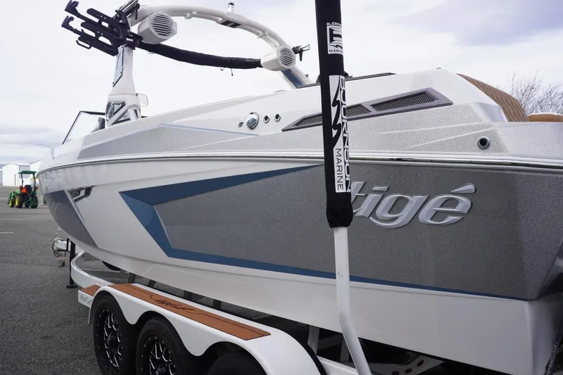Slide: The Image of 2023 Tigé 24RZX boat on trailer, showcasing sleek design and modern features. - 7