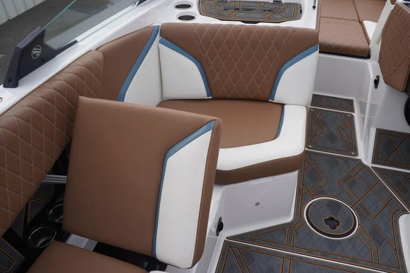 Slide: The Image of 2023 Tigé 24RZX boat interior with brown and white seating, diamond stitching, and stylish flooring. - 70