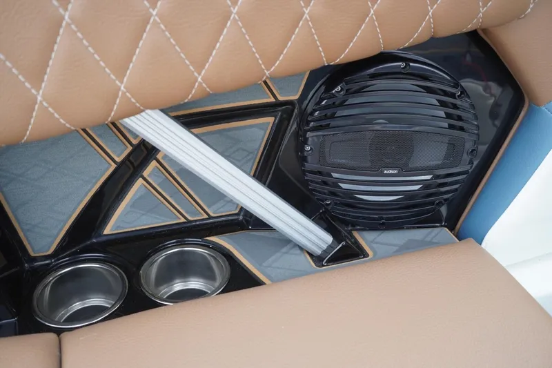 Slide: The Image of 2023 Tigé 24RZX interior with speaker, cup holders, and quilted upholstery. - 75