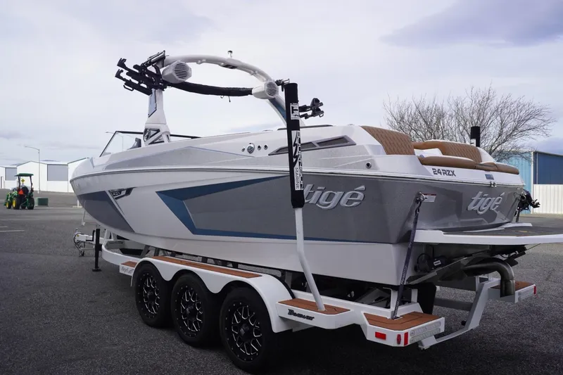 Slide: The Image of 2023 Tigé 24RZX boat on trailer, showcasing sleek design and modern features. - 8