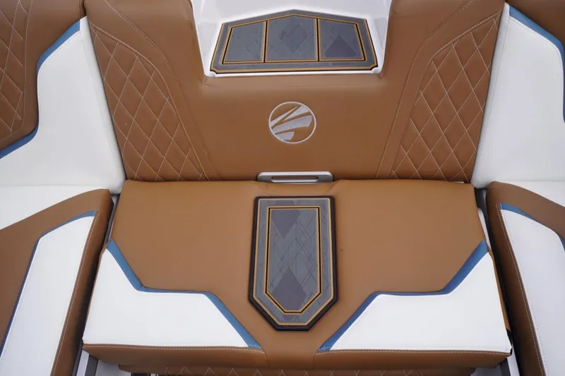 Slide: The Image of 2023 Tigé 24RZX boat interior with brown and white leather seats, featuring blue accents. - 80