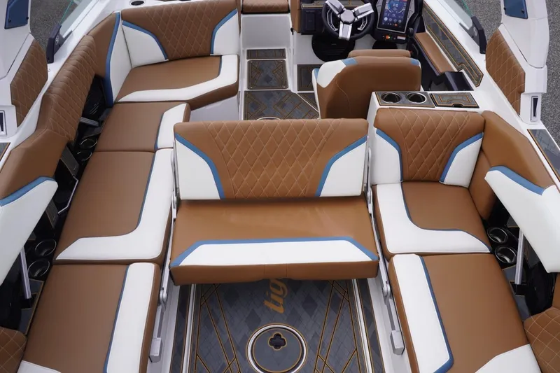 Slide: The Image of Luxurious interior of 2023 Tigé 24RZX boat with brown and white seating. - 83
