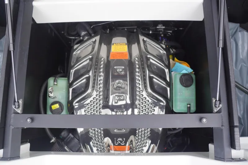 Slide: The Image of 2023 Tigé 24RZX boat engine compartment with visible components and labels. - 87
