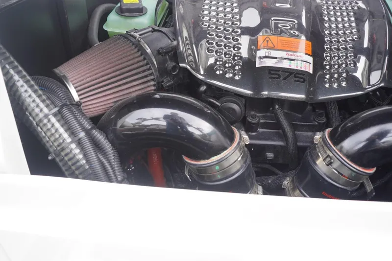 Slide: The Image of 2023 Tigé 24RZX engine compartment with Indmar 575 engine and air filter. - 89