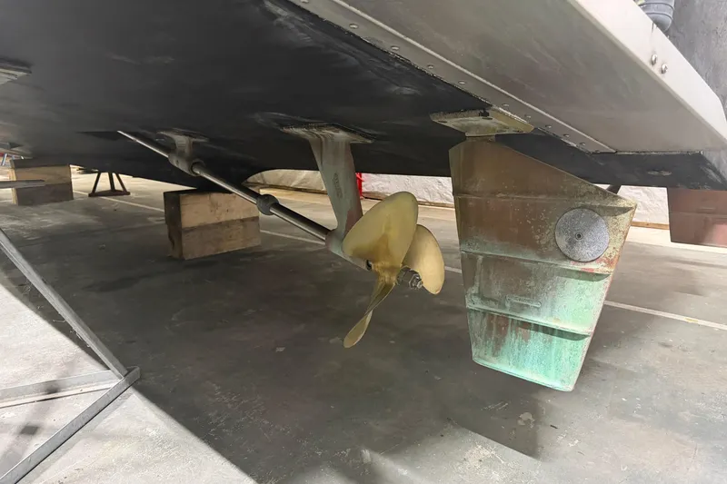 Slide: The Image of 1989 Tiara Yachts 3600 Open propeller and rudder in dry dock. - 12