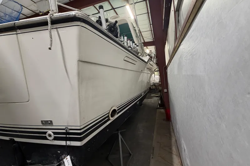 Slide: The Image of 1989 Tiara Yachts 3600 Open in storage, showcasing sleek design and sturdy construction. - 13