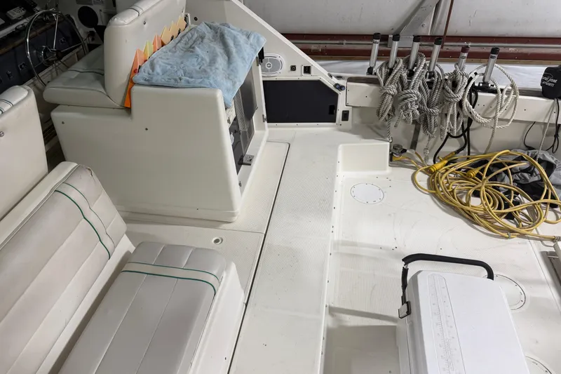 Slide: The Image of 1989 Tiara Yachts 3600 Open interior with seating, ropes, and equipment. - 18
