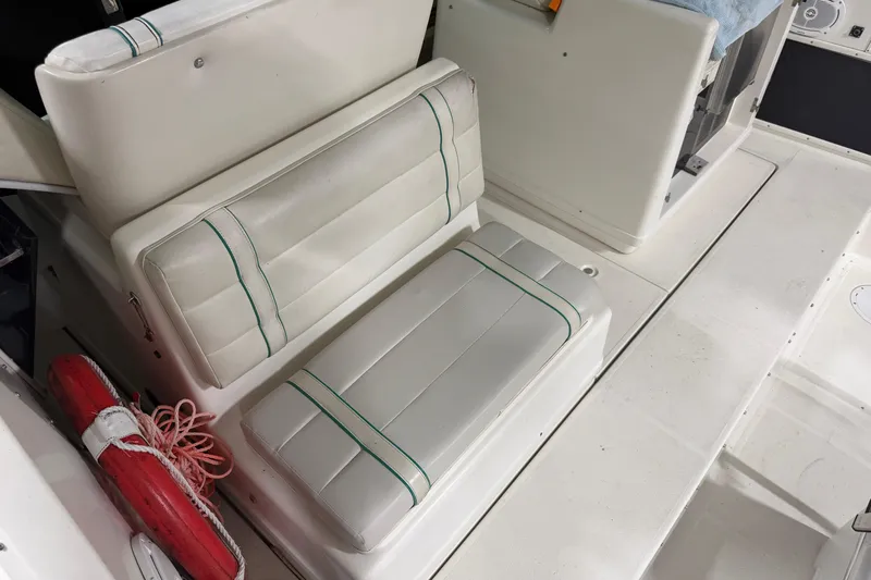 Slide: The Image of 1989 Tiara Yachts 3600 Open interior seating with life preserver. - 19