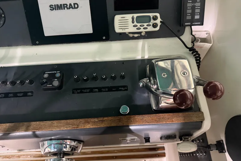 Slide: The Image of Control panel of a 1989 Tiara Yachts 3600 Open with navigation equipment. - 27