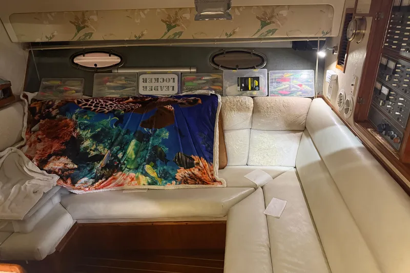 Slide: The Image of Interior of 1989 Tiara Yachts 3600 Open with cozy seating and marine-themed decor. - 33