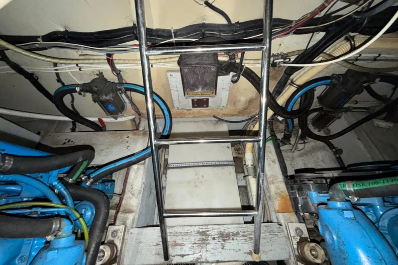 Slide: The Image of Engine room of 1989 Tiara Yachts 3600 Open with visible wiring and components. - 54