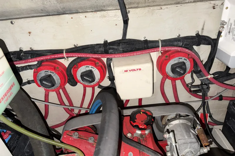 Slide: The Image of Engine compartment of a 1989 Tiara Yachts 3600 Open, featuring electrical switches and wiring. - 57