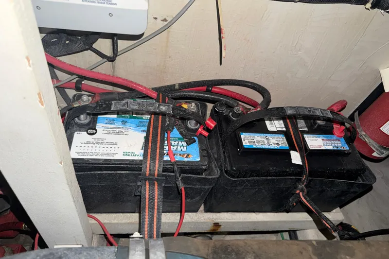 Slide: The Image of Marine batteries in a 1989 Tiara Yachts 3600 Open engine compartment. - 58