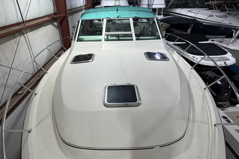 Slide: The Image of 1989 Tiara Yachts 3600 Open boat in storage, top view of deck and windows. - 8