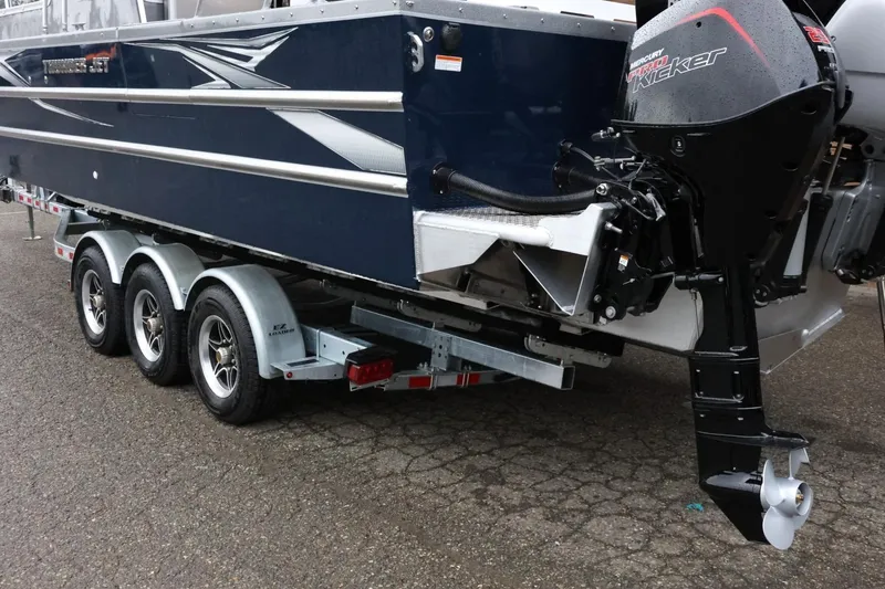 Slide: The Image of 2026 Thunder Jet 28 Pilot boat on trailer with Mercury outboard motor. - 10