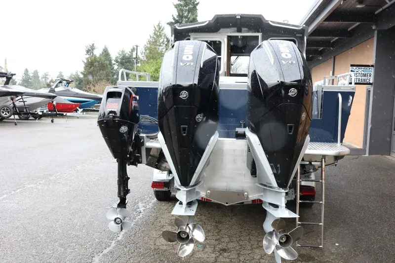 Slide: The Image of 2026 Thunder Jet 28 Pilot boat with dual V8 engines, parked outdoors. - 12