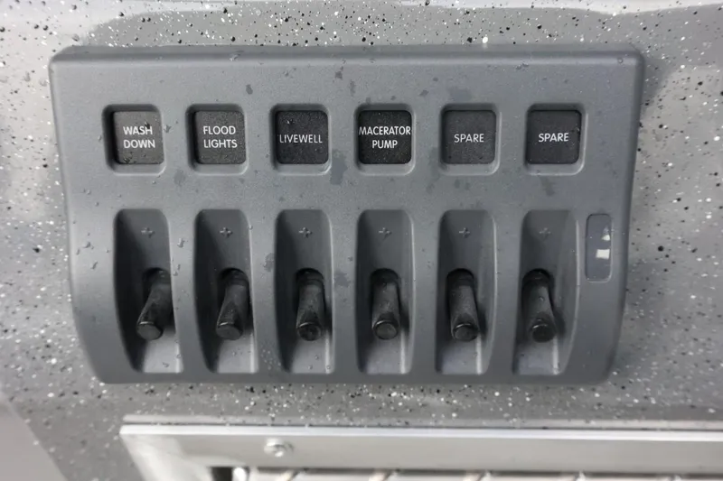 Slide: The Image of Control panel of 2026 Thunder Jet 28 Pilot boat with labeled switches. - 18
