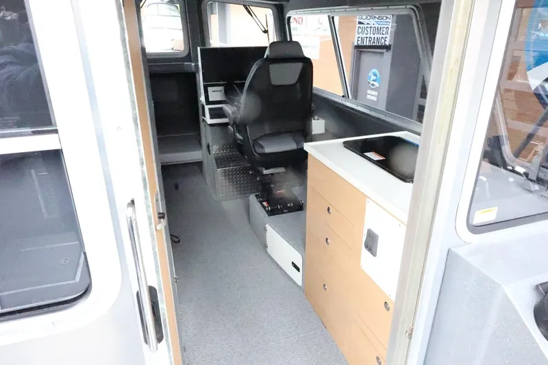 Slide: The Image of Interior of 2026 Thunder Jet 28 Pilot boat with seating and control panel. - 19