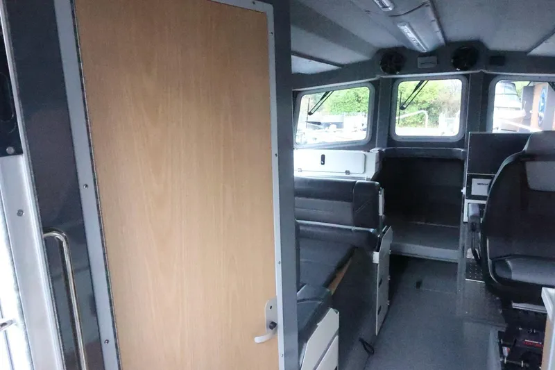 Slide: The Image of Interior of 2026 Thunder Jet 28 Pilot boat, featuring seating and control area. - 21