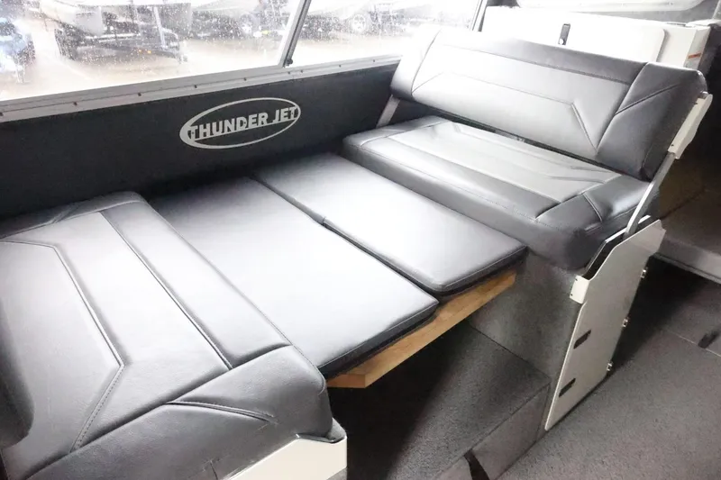 Slide: The Image of 2026 Thunder Jet 28 Pilot interior seating with black leather upholstery. - 23