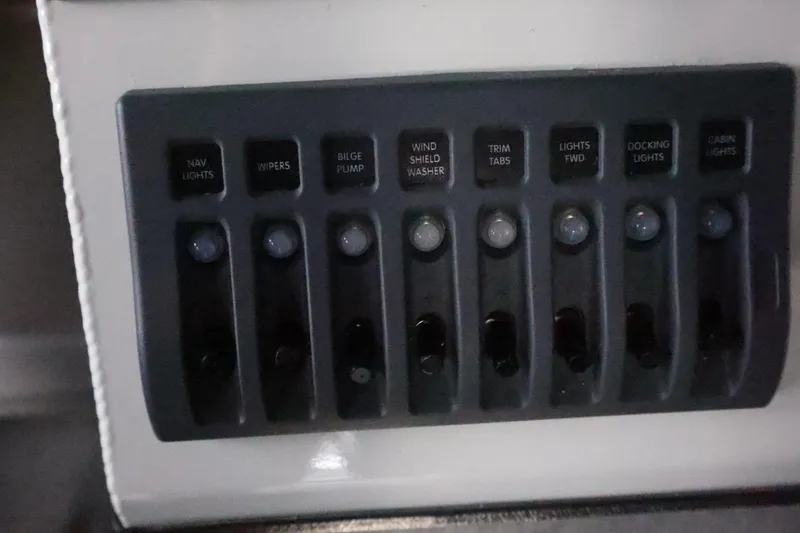 Slide: The Image of Control panel of 2026 Thunder Jet 28 Pilot boat with labeled switches. - 25