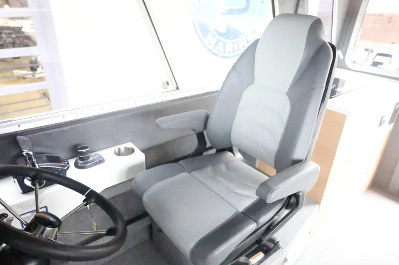 Slide: The Image of 2026 Thunder Jet 28 Pilot interior with captain's chair and steering wheel. - 29