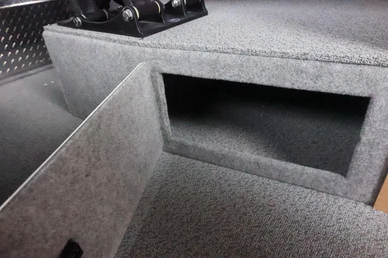 Slide: The Image of Interior storage compartment of 2026 Thunder Jet 28 Pilot boat, featuring carpeted finish. - 32