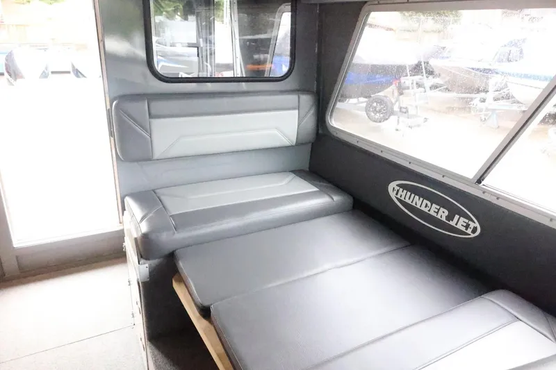 Slide: The Image of Interior of 2026 Thunder Jet 28 Pilot boat with seating and logo. - 33