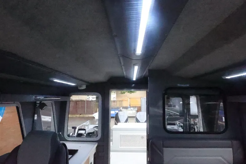 Slide: The Image of Interior view of 2026 Thunder Jet 28 Pilot boat with modern lighting and seating. - 40