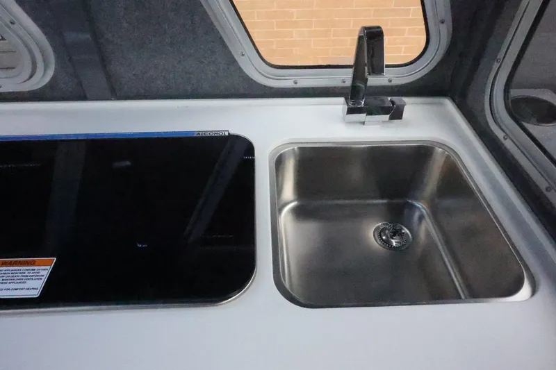 Slide: The Image of 2026 Thunder Jet 28 Pilot interior with stainless steel sink and modern faucet. - 45