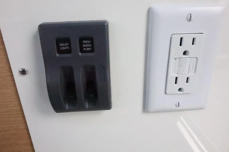 Slide: The Image of Control panel and outlet in 2026 Thunder Jet 28 Pilot boat interior. - 46