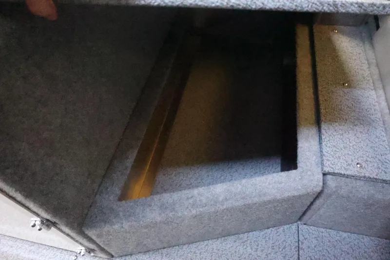 Slide: The Image of Interior storage compartment of 2026 Thunder Jet 28 Pilot boat, featuring carpeted finish. - 50