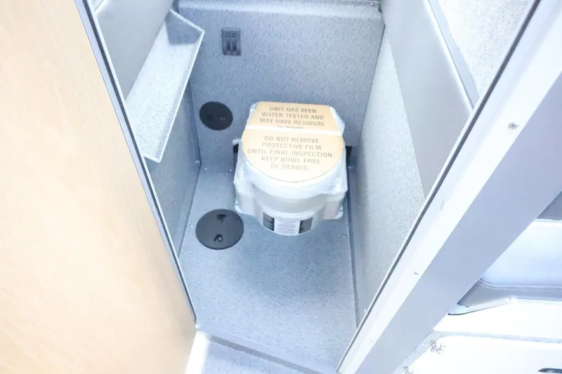 Slide: The Image of Interior of 2026 Thunder Jet 28 Pilot boat showing a compact toilet area. - 55