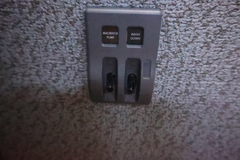 Slide: The Image of Control panel with macerator pump and wash down switches in 2026 Thunder Jet 28 Pilot. - 56