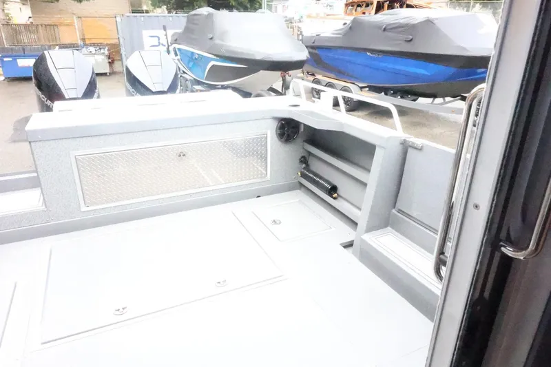 Slide: The Image of 2026 Thunder Jet 28 Pilot boat interior with storage and seating area. - 58