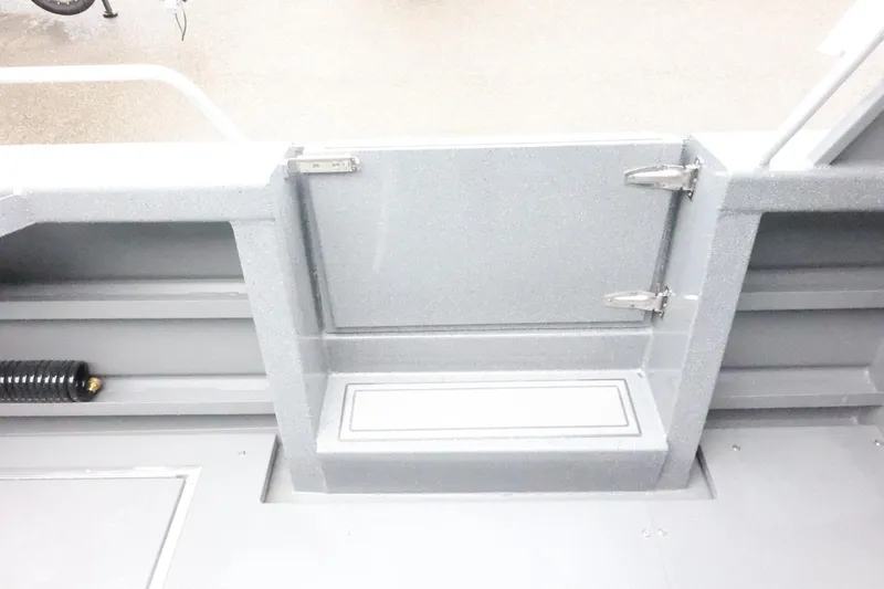 Slide: The Image of 2026 Thunder Jet 28 Pilot boat interior with gray textured finish and secure hatch. - 60