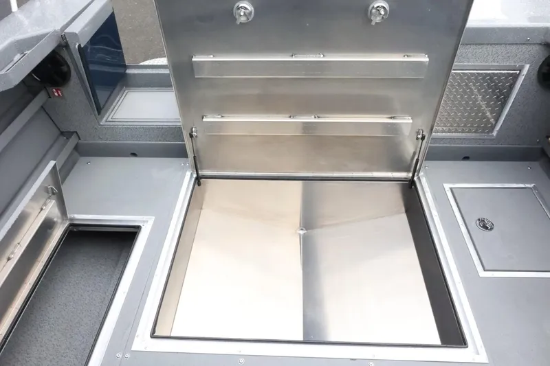 Slide: The Image of 2026 Thunder Jet 28 Pilot boat interior with open storage compartment. - 65