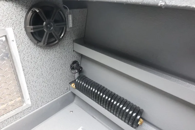 Slide: The Image of Interior of 2026 Thunder Jet 28 Pilot boat with speaker and coiled hose. - 68