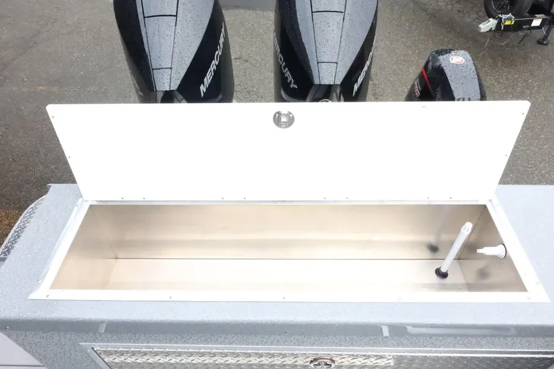 Slide: The Image of Open storage compartment on 2026 Thunder Jet 28 Pilot boat with Mercury engines. - 71